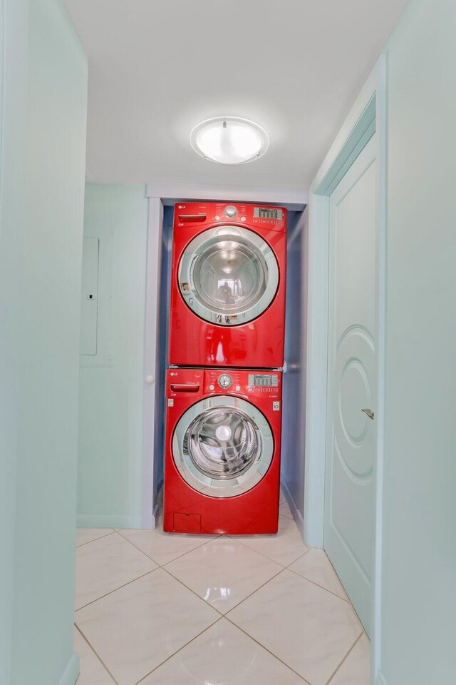 4101 N Ocean Blvd Unit 908, Boca Raton, FL 33431 - laundry area with estacked washer and dryer and tile patterned floors