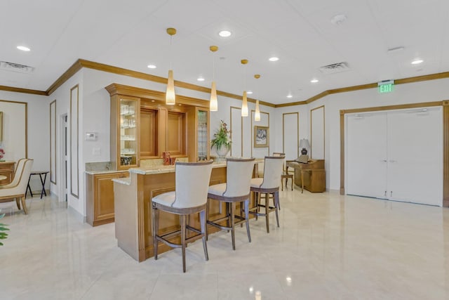 4101 N Ocean Blvd Unit 908, Boca Raton, FL 33431 - kitchen featuring ornamental molding, brown cabinets, a kitchen breakfast bar, light stone countertops, and glass insert cabinets
