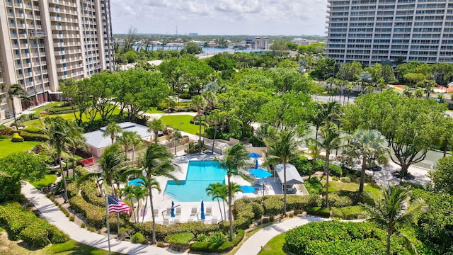 4101 N Ocean Blvd Unit 908, Boca Raton, FL 33431 - drone / aerial view of a pool area and a tree filled landscape