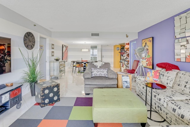 4101 N Ocean Blvd Unit 908, Boca Raton, FL 33431 - living room featuring a textured ceiling