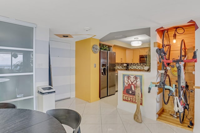 4101 N Ocean Blvd Unit 908, Boca Raton, FL 33431 - kitchen with appliances with stainless steel finishes, light tile patterned floors, and decorative backsplash