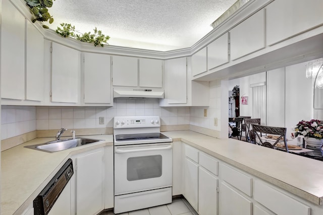 1102 Green Pine Blvd Unit A1, West Palm Beach, FL 33409 - kitchen featuring white appliances, premium range hood, light countertops, a textured ceiling, and backsplash