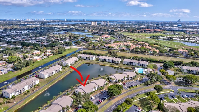 1102 Green Pine Blvd Unit A1, West Palm Beach, FL 33409 - aerial overview of property's location featuring a nearby body of water, nearby suburban area, and a local golf course