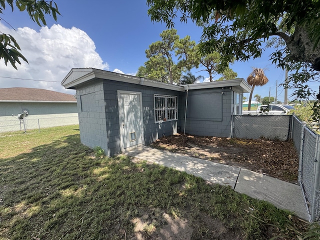1801 N 25th St, Fort Pierce, FL 34947 - rear view of property featuring concrete block siding