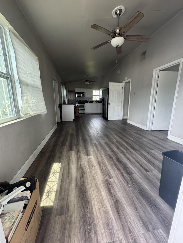 1801 N 25th St, Fort Pierce, FL 34947 - unfurnished living room with lofted ceiling, dark wood-style flooring, and a ceiling fan