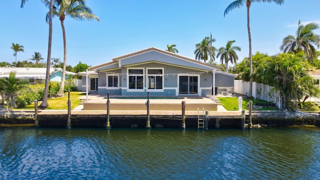 1555 SE 7th St, Deerfield Beach, FL 33441 - back of house with a water view and stucco siding