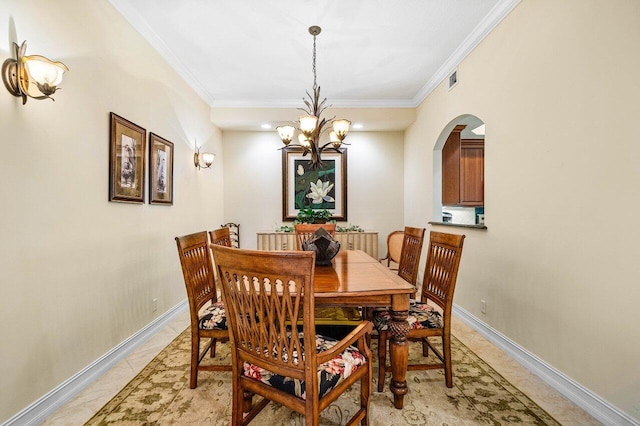 112 Palm Bay Dr Unit A, Palm Beach Gardens, FL 33418 - dining area featuring crown molding, arched walkways, and a chandelier