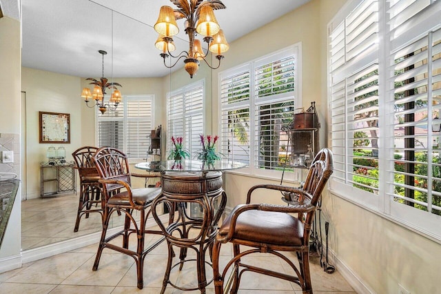 112 Palm Bay Dr Unit A, Palm Beach Gardens, FL 33418 - dining area with a chandelier and light tile patterned floors