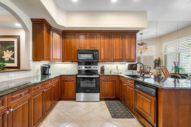 112 Palm Bay Dr Unit A, Palm Beach Gardens, FL 33418 - kitchen featuring electric range, black microwave, dishwasher, a peninsula, and dark stone counters
