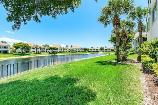 112 Palm Bay Dr Unit A, Palm Beach Gardens, FL 33418 - view of yard with a residential view and a water view
