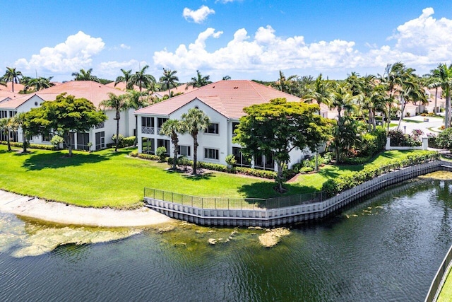 112 Palm Bay Dr Unit A, Palm Beach Gardens, FL 33418 - rear view of property featuring a water view, a lawn, and stucco siding
