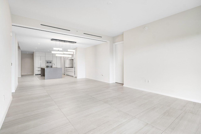 200 SE Mizner Blvd Unit 514, Boca Raton, FL 33432 - unfurnished living room with baseboards
