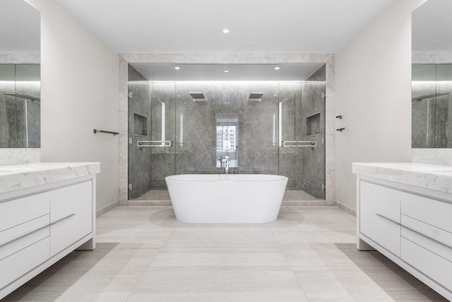 200 SE Mizner Blvd Unit 514, Boca Raton, FL 33432 - full bathroom with vanity, a stall shower, and a soaking tub