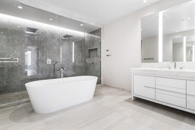 200 SE Mizner Blvd Unit 514, Boca Raton, FL 33432 - bathroom featuring a freestanding tub, vanity, a marble finish shower, and recessed lighting
