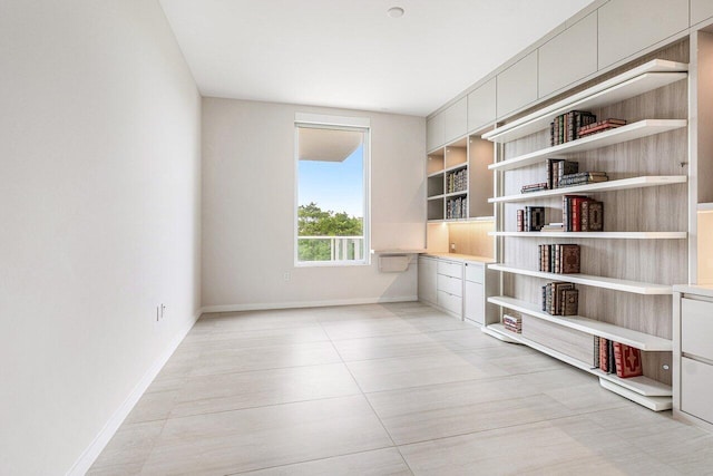 200 SE Mizner Blvd Unit 514, Boca Raton, FL 33432 - spare room with baseboards and light tile patterned flooring