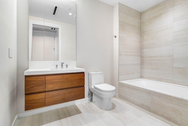 200 SE Mizner Blvd Unit 514, Boca Raton, FL 33432 - bathroom featuring tiled tub and vanity
