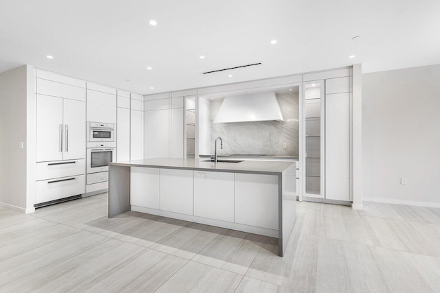 200 SE Mizner Blvd Unit 514, Boca Raton, FL 33432 - kitchen featuring modern cabinets, premium range hood, white cabinetry, white double oven, and recessed lighting