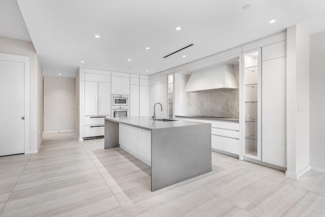 200 SE Mizner Blvd Unit 514, Boca Raton, FL 33432 - kitchen featuring modern cabinets, premium range hood, white cabinetry, and recessed lighting
