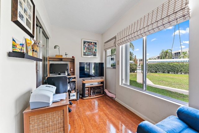 3186 Via Poinciana Unit 111, Lake Worth, FL 33467 - living room with wood finished floors and baseboards