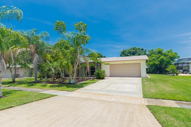 309 NE Jonquil St, Port Saint Lucie, FL 34983 - view of property hidden behind natural elements with concrete driveway, a garage, a front lawn, and stucco siding