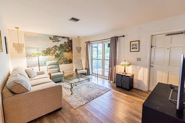 309 NE Jonquil St, Port Saint Lucie, FL 34983 - living room featuring wood finished floors