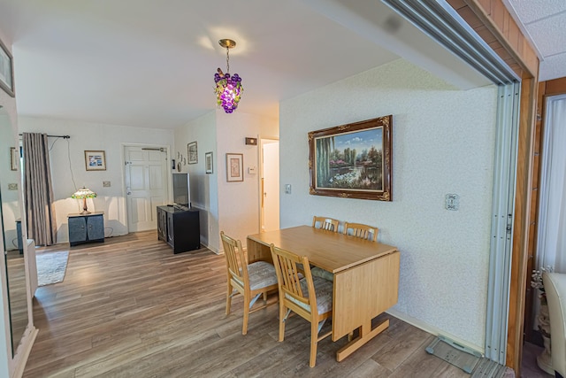 309 NE Jonquil St, Port Saint Lucie, FL 34983 - dining space with wood finished floors and baseboards