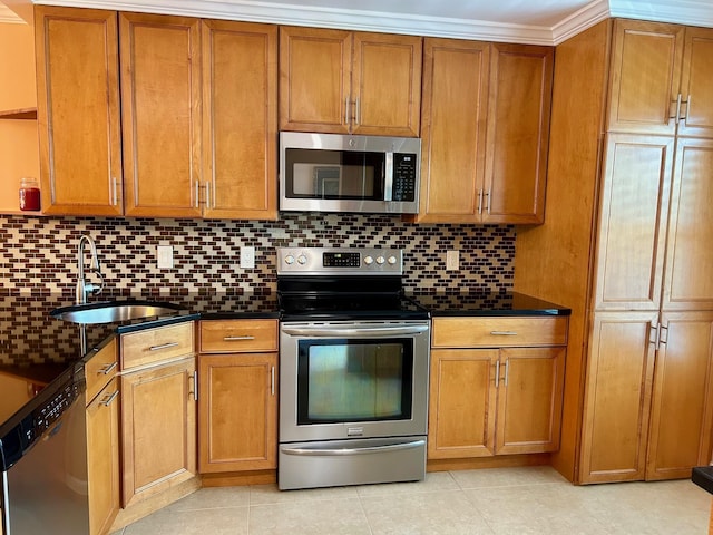 1868 SW Palm City Rd Unit 304, Stuart, FL 34994 - kitchen featuring appliances with stainless steel finishes, dark countertops, and brown cabinetry