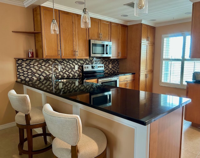 1868 SW Palm City Rd Unit 304, Stuart, FL 34994 - kitchen featuring stainless steel appliances, dark countertops, open shelves, brown cabinets, and a peninsula