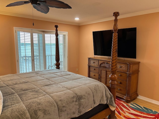 1868 SW Palm City Rd Unit 304, Stuart, FL 34994 - bedroom featuring ornamental molding, wood finished floors, and a ceiling fan