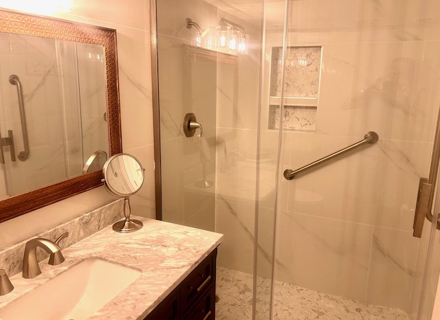 1868 SW Palm City Rd Unit 304, Stuart, FL 34994 - bathroom featuring a shower stall and vanity