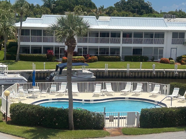 1868 SW Palm City Rd Unit 304, Stuart, FL 34994 - community pool featuring a patio area and a water view