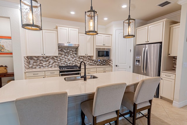 12736 SW Cattleya Ln, Port Saint Lucie, FL 34987 - kitchen featuring appliances with stainless steel finishes, backsplash, a kitchen bar, light countertops, and crown molding
