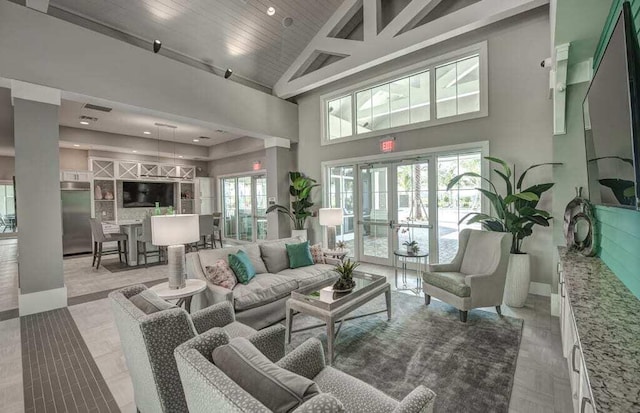 12736 SW Cattleya Ln, Port Saint Lucie, FL 34987 - living area featuring high vaulted ceiling and french doors