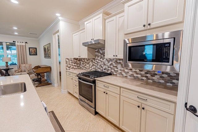 12736 SW Cattleya Ln, Port Saint Lucie, FL 34987 - kitchen with stainless steel appliances, light countertops, open floor plan, decorative backsplash, and under cabinet range hood