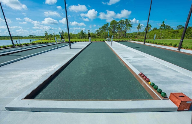 12736 SW Cattleya Ln, Port Saint Lucie, FL 34987 - surrounding community featuring a bocce ball area, a water view, and view of scattered trees