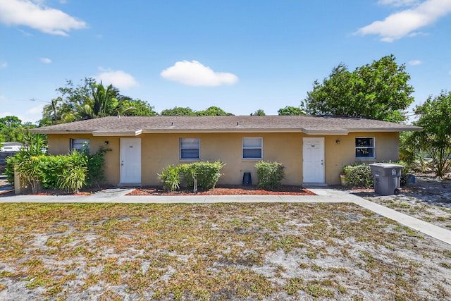 7891 Loomis St Unit 7891/7893, Lake Worth, FL 33462 - view of front of house with stucco siding