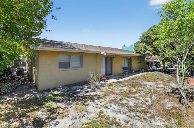 7891 Loomis St Unit 7891/7893, Lake Worth, FL 33462 - back of property featuring stucco siding