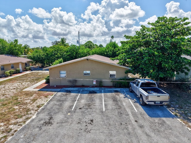 7891 Loomis St Unit 7891/7893, Lake Worth, FL 33462 - view of uncovered parking lot
