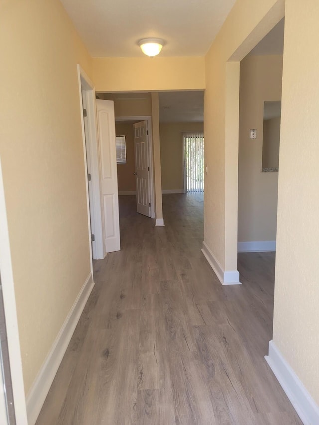 7891 Loomis St Unit 7891/7893, Lake Worth, FL 33462 - hall with wood finished floors and baseboards