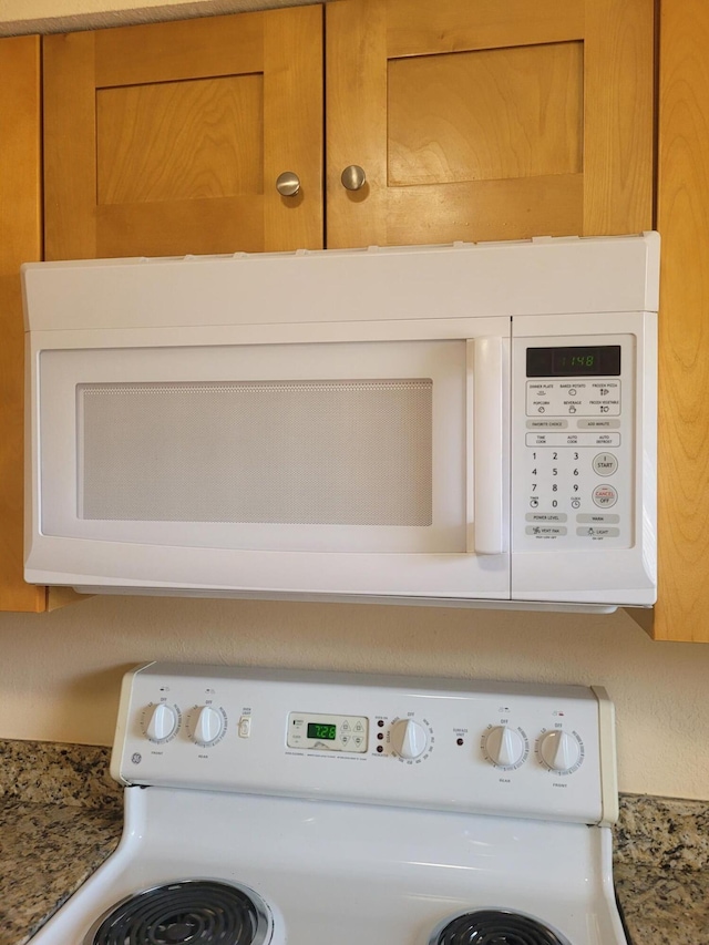 7891 Loomis St Unit 7891/7893, Lake Worth, FL 33462 - kitchen view of white microwave and washer / dryer