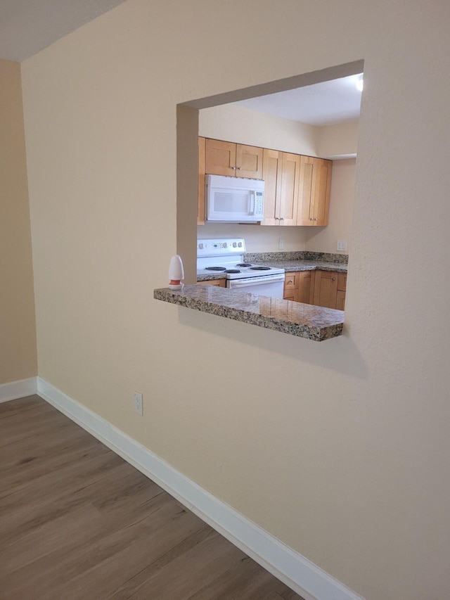 7891 Loomis St Unit 7891/7893, Lake Worth, FL 33462 - kitchen with white appliances, dark wood-type flooring, and light brown cabinets