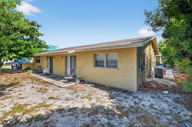 7891 Loomis St Unit 7891/7893, Lake Worth, FL 33462 - view of front facade with stucco siding and a patio