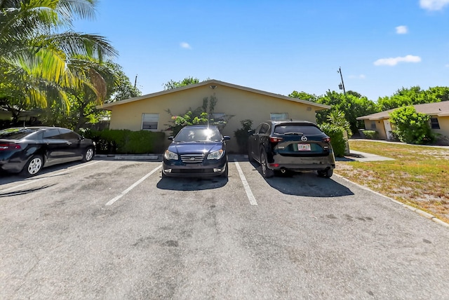 7891 Loomis St Unit 7891/7893, Lake Worth, FL 33462 - view of front of property featuring uncovered parking and stucco siding