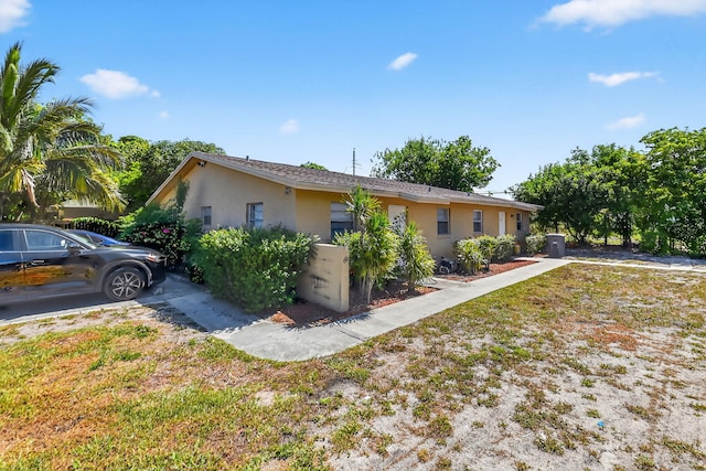 7891 Loomis St Unit 7891/7893, Lake Worth, FL 33462 - view of side of property with stucco siding