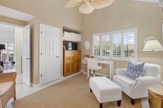 574 Emerald Way E, Deerfield Beach, FL 33442 - sitting room featuring a ceiling fan, light tile patterned floors, and a high ceiling
