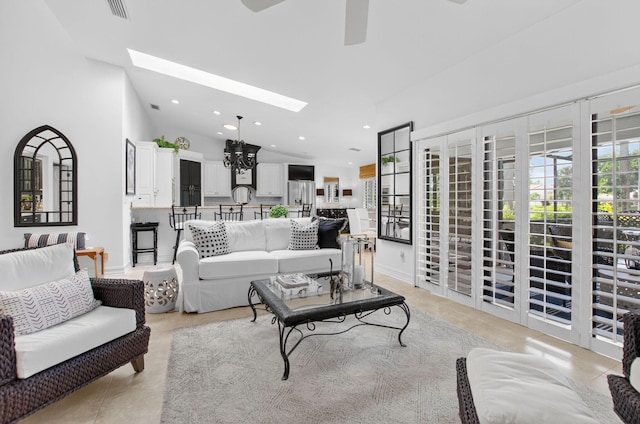 574 Emerald Way E, Deerfield Beach, FL 33442 - living room with a skylight, ceiling fan, recessed lighting, light tile patterned flooring, and vaulted ceiling