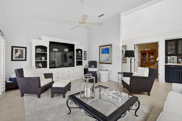 574 Emerald Way E, Deerfield Beach, FL 33442 - living area with light tile patterned floors, ceiling fan, and a high ceiling