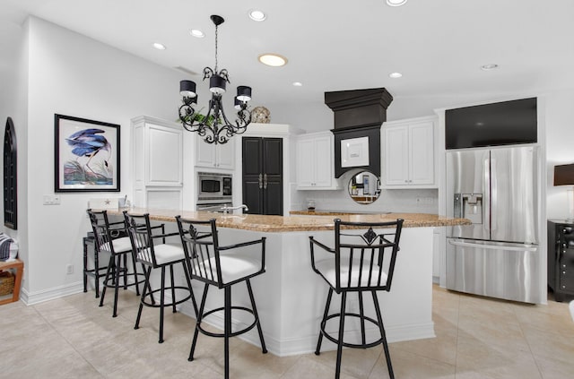 574 Emerald Way E, Deerfield Beach, FL 33442 - kitchen featuring stainless steel appliances, a kitchen breakfast bar, white cabinets, a peninsula, and recessed lighting