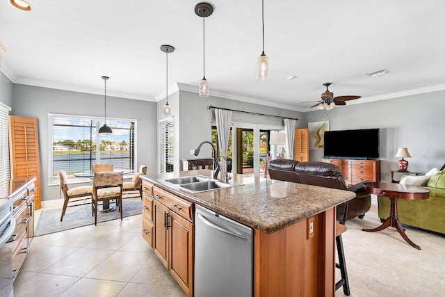 7141 Charleston Point Dr, Lake Worth, FL 33467 - kitchen featuring stainless steel dishwasher, an island with sink, ceiling fan, brown cabinetry, and crown molding