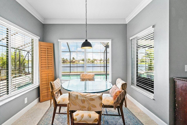 7141 Charleston Point Dr, Lake Worth, FL 33467 - dining room with ornamental molding, healthy amount of natural light, a water view, and light tile patterned floors